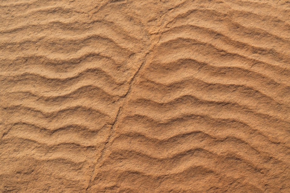 Close-up of symmetric and asymmetric ripple marks on a sandstone bedding plane